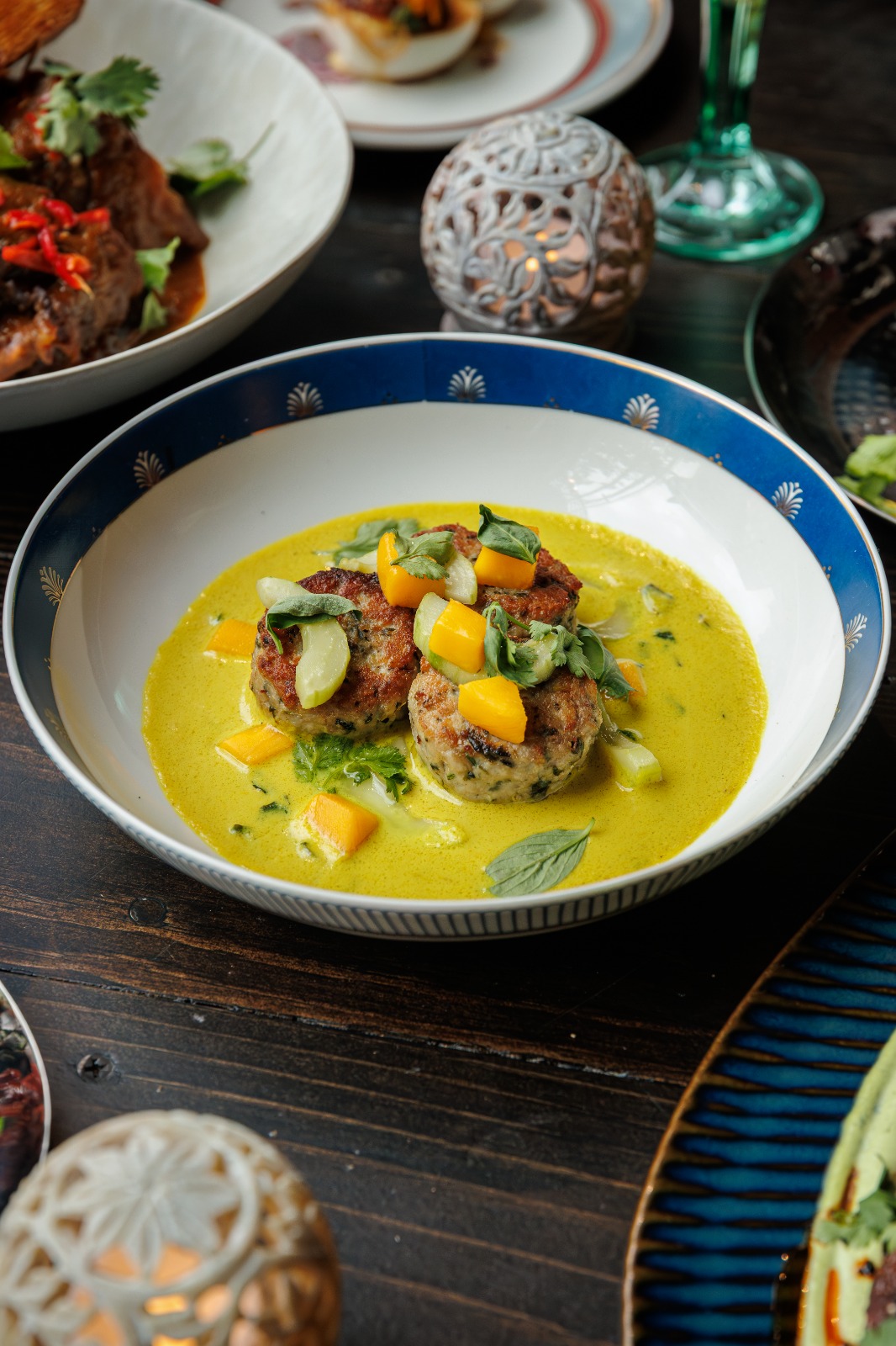 Basil Chicken Kofta in turmeric and lemongrass curry with mango cucumber slaw